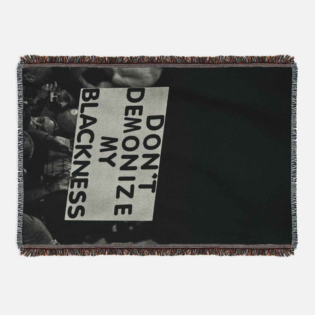 Don't Demonize My Blackness Woven Blanket